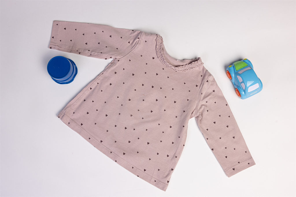 Pink top with black hearts