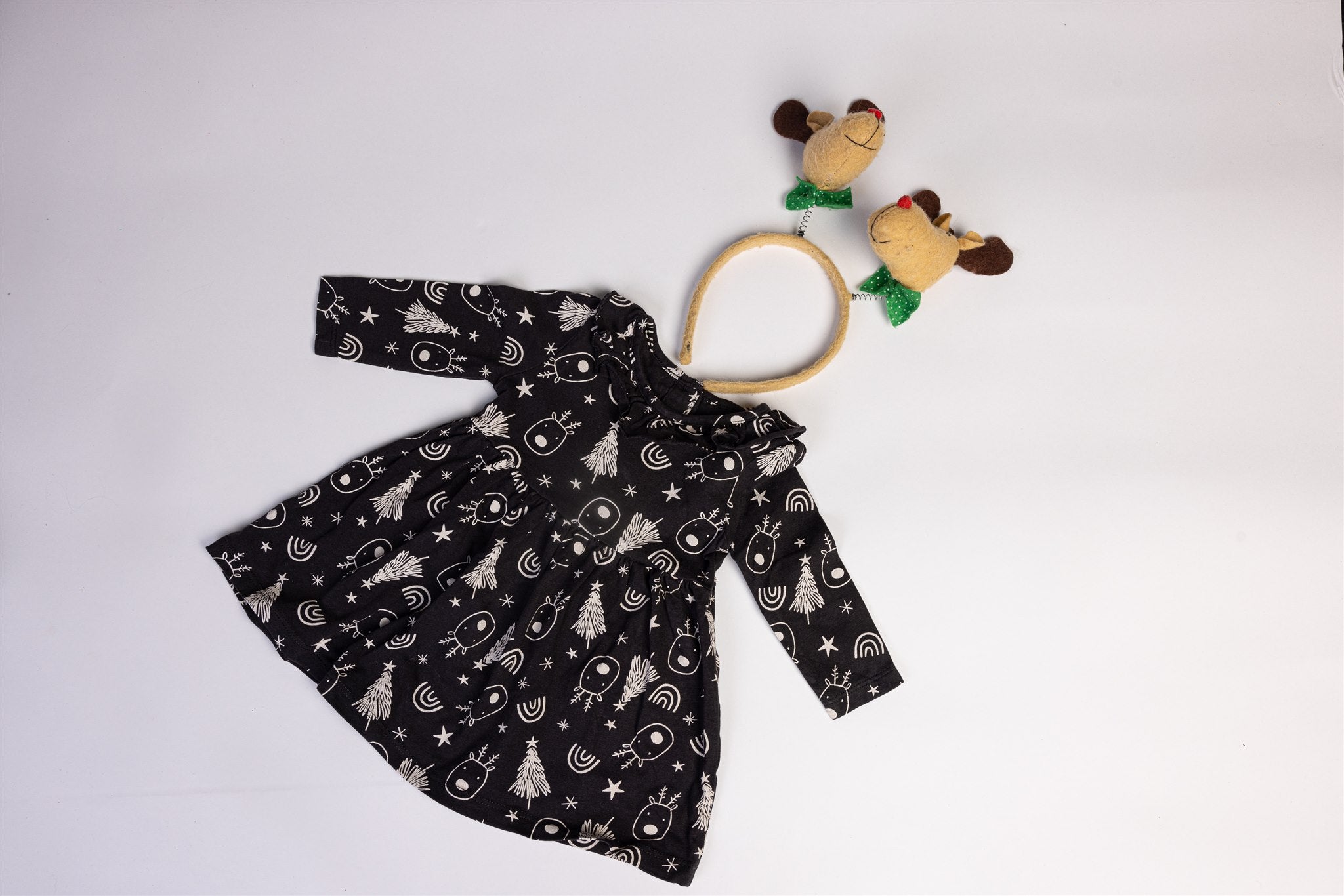 Black dress with reindeer and christmas tree motifs