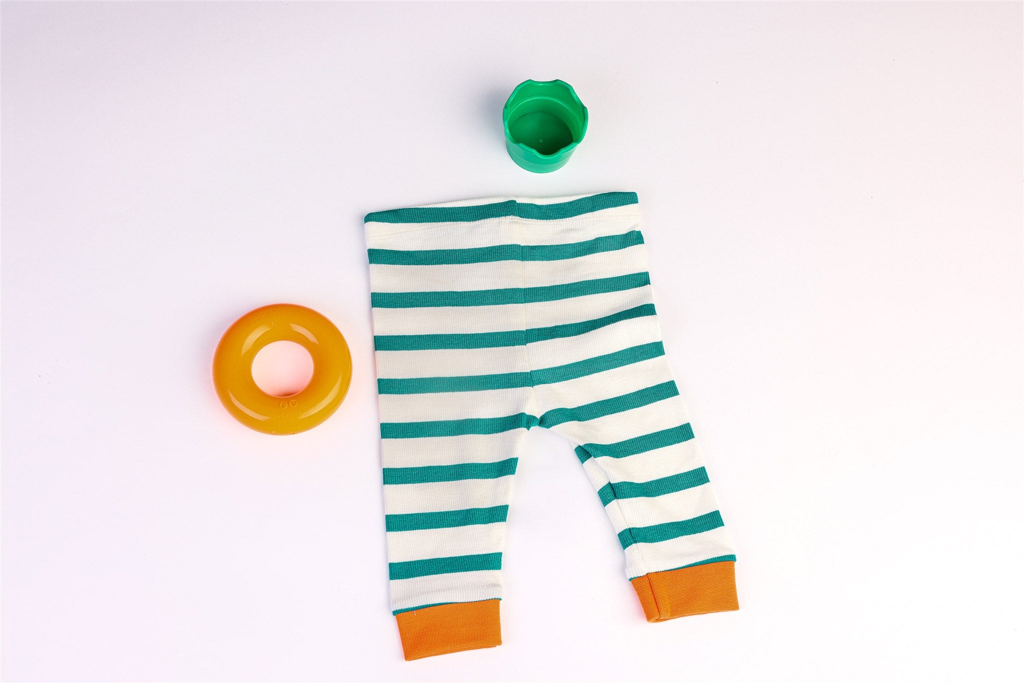 White trousers with green stripes and orange bottoms