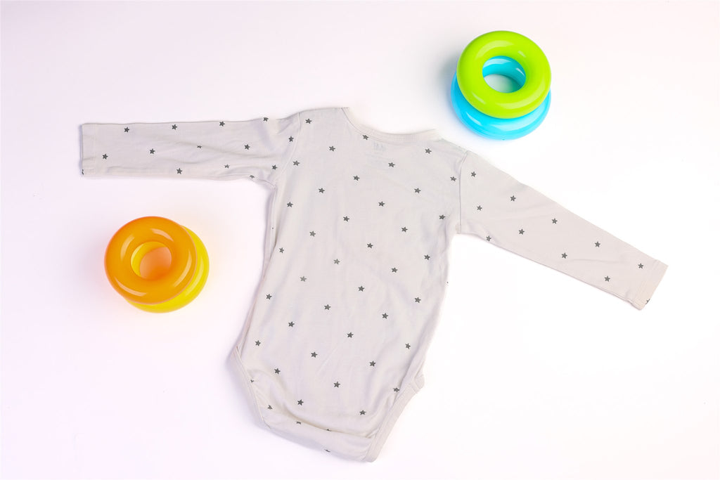 White long-sleeved bodysuit with black stars