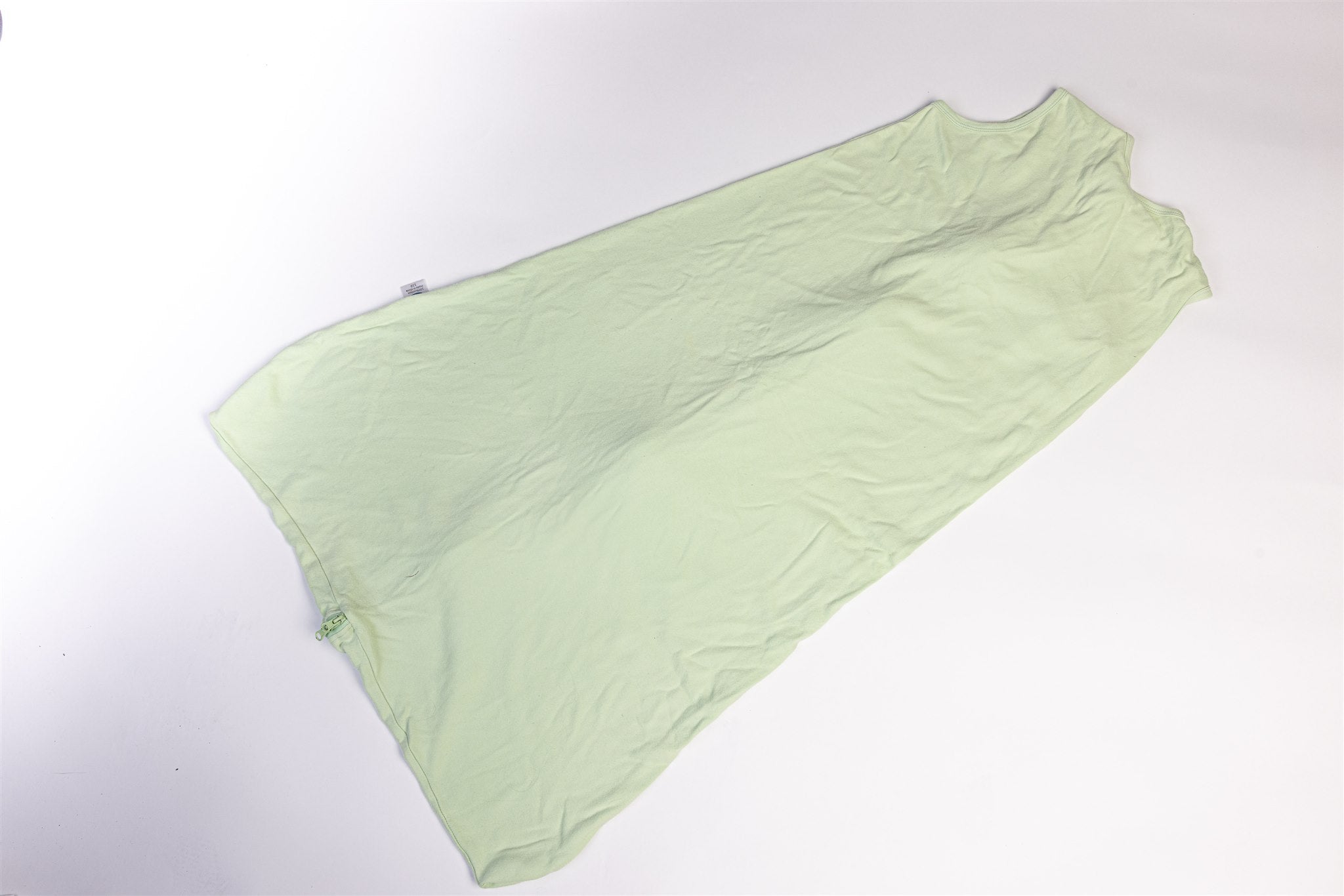 Green sleeping bag with giraffe