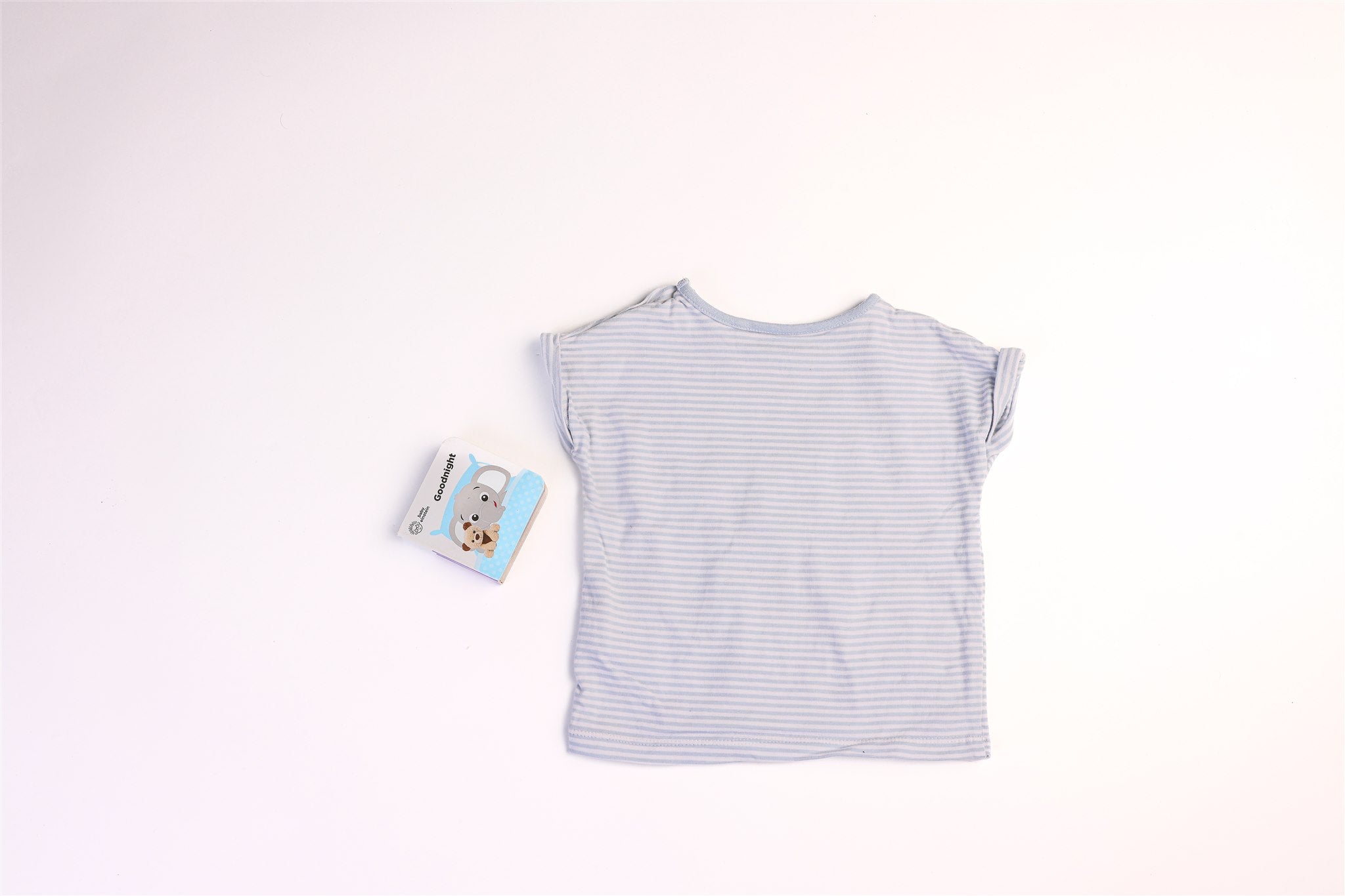 White and blue striped top with dog