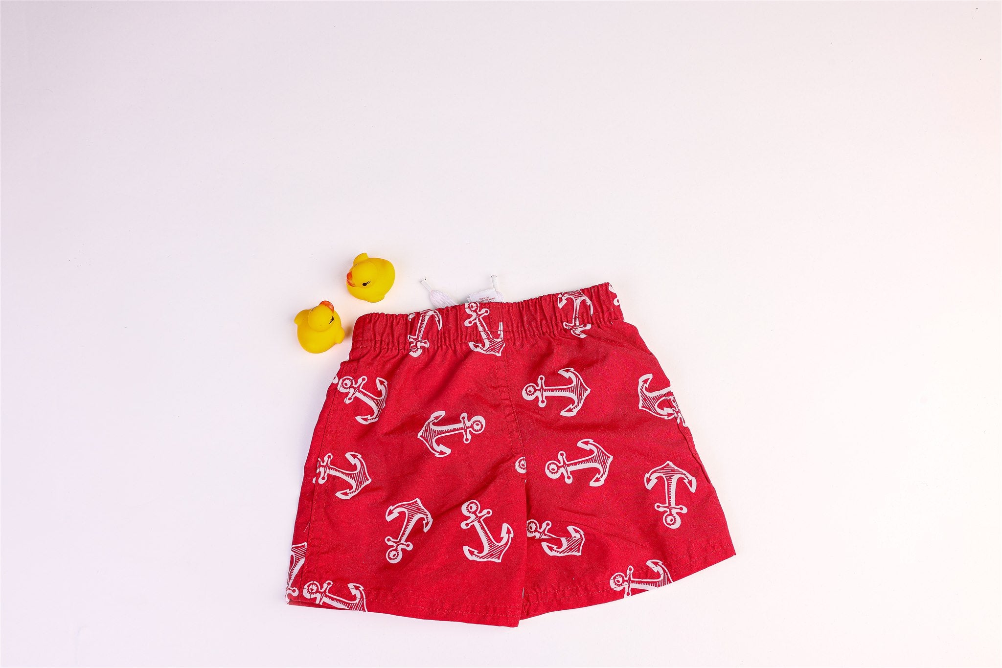 Red swimsuit with anchor pattern