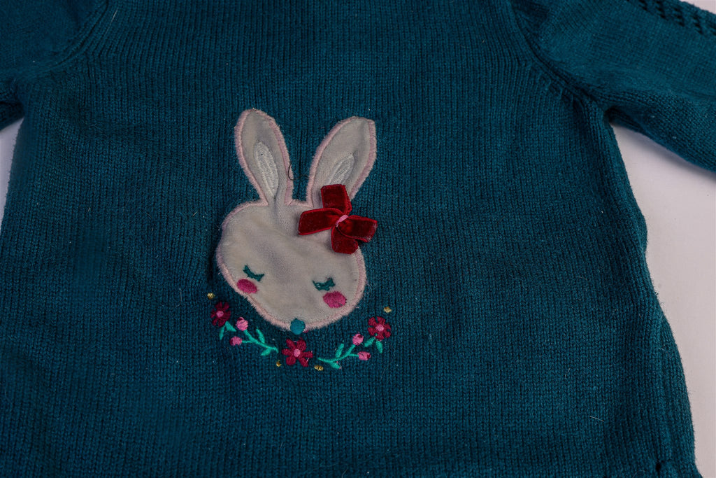 Green jumper with white rabbit and flowers