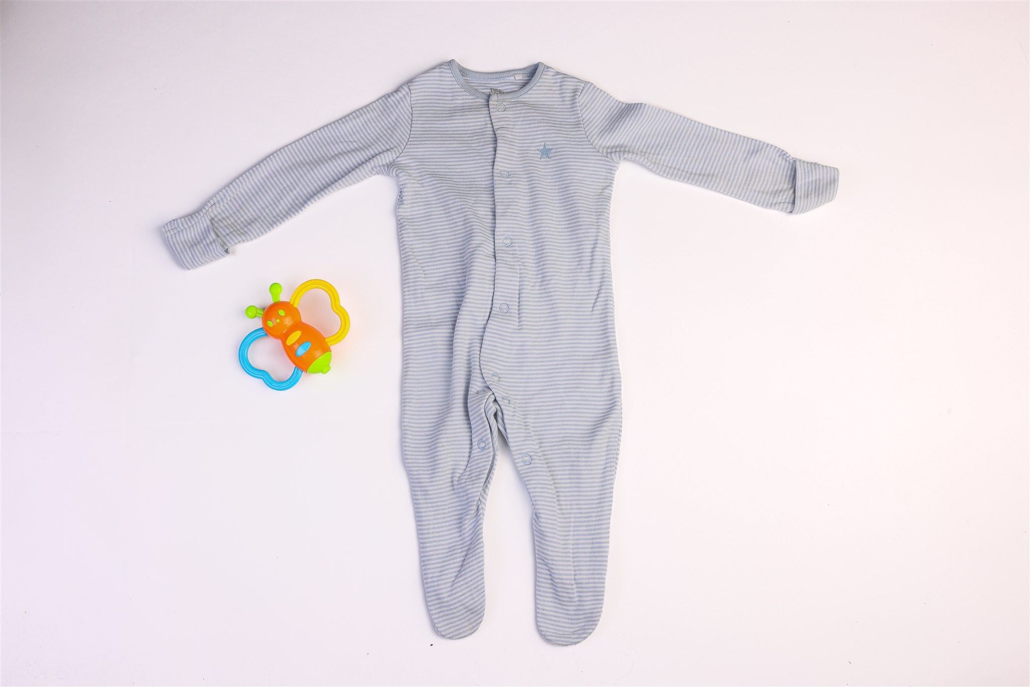 Blue striped sleepsuit with small blue star