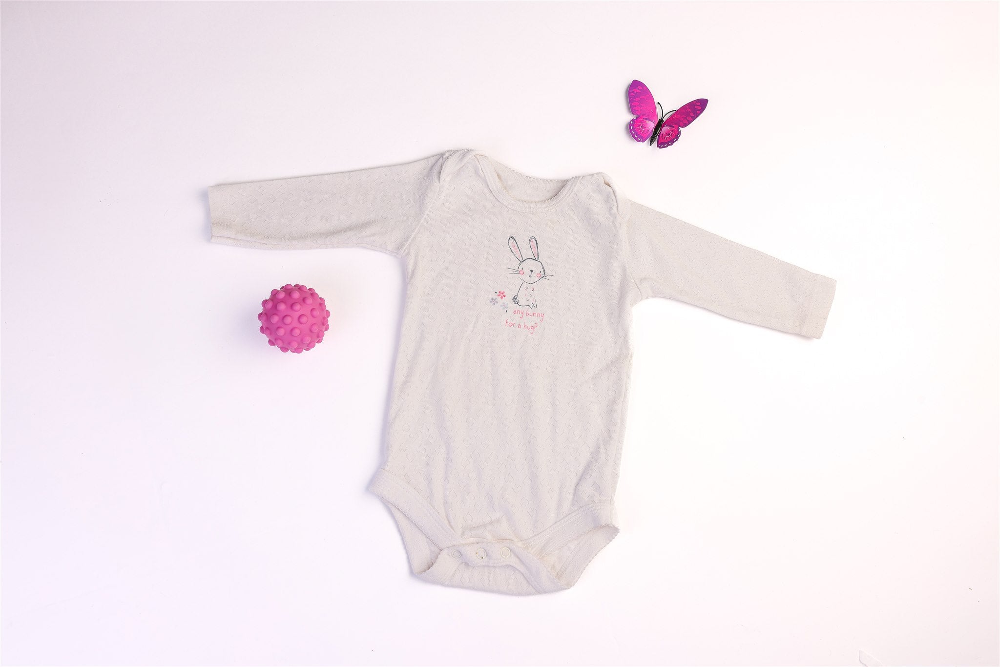 White long-sleeved "Any bunny for a hug?" bodysuit