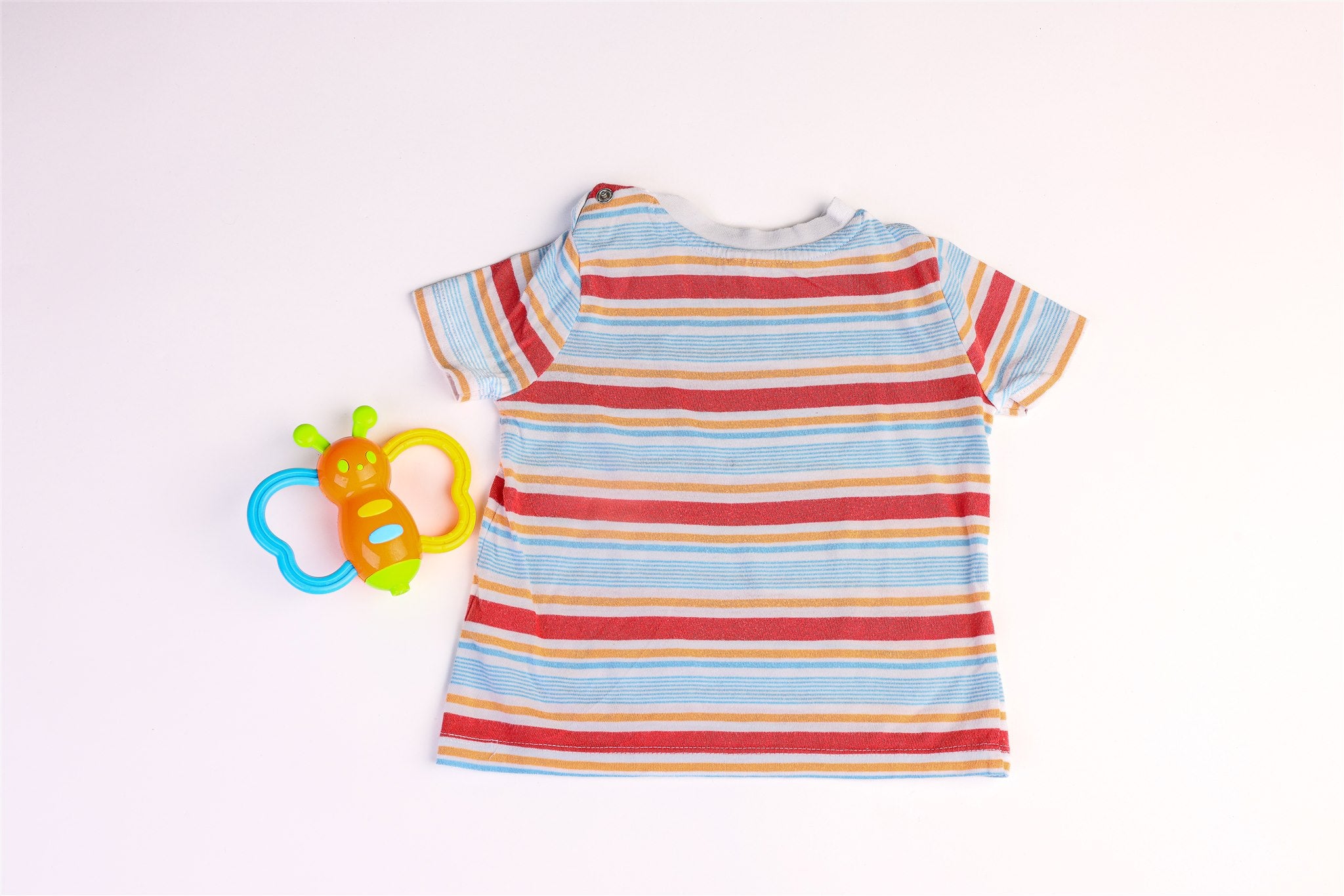 Blue, orange, and red striped top