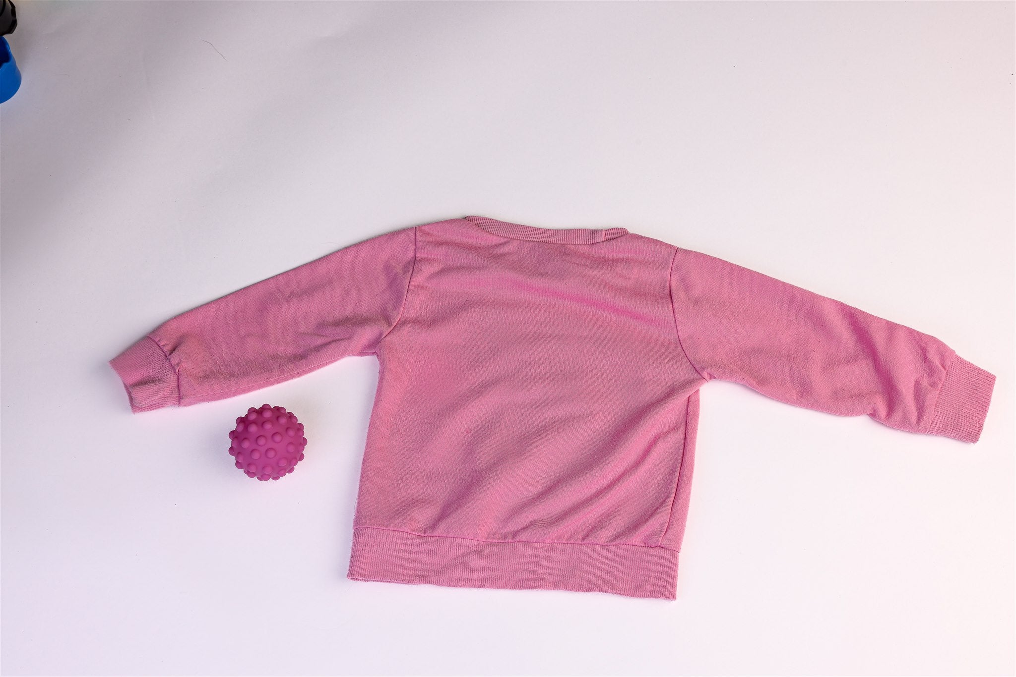 Pink elephant and bunny on a cloud holding a star jumper