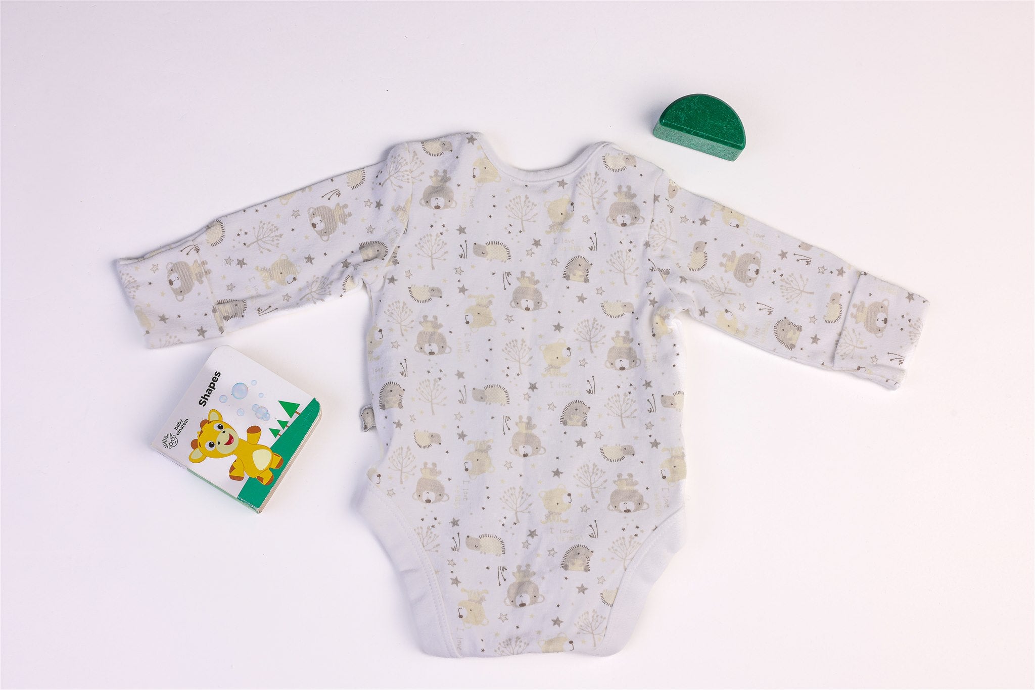 White bodysuit with hedgehogs and teddy bears