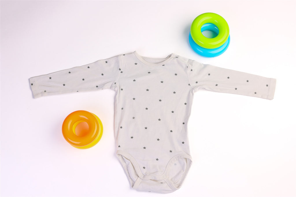 White long-sleeved bodysuit with black stars