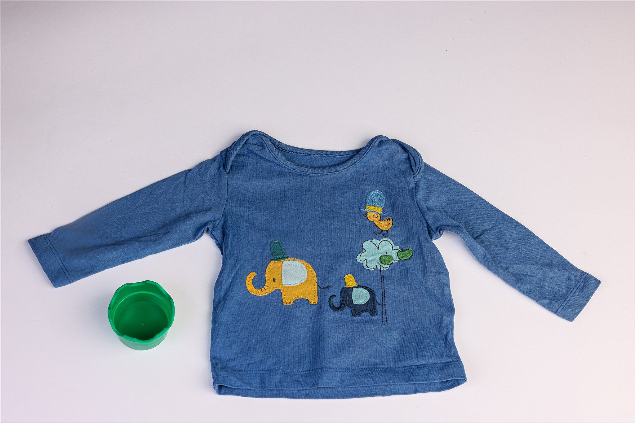 Blue top with little elephants, bird, and tree