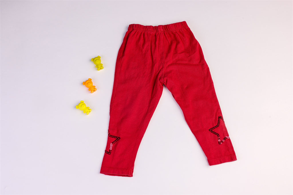 Red trousers with sequined stars