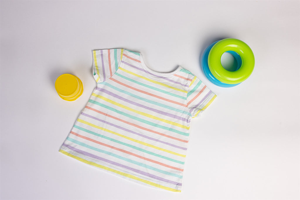 White top with yellow, salmon, and green stripes