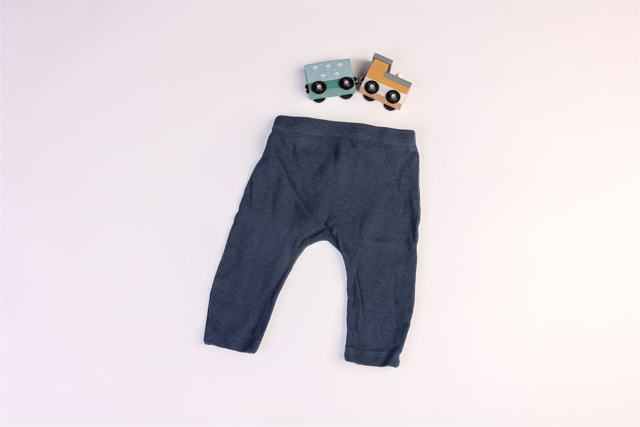 Blue trousers with decorative drawstring