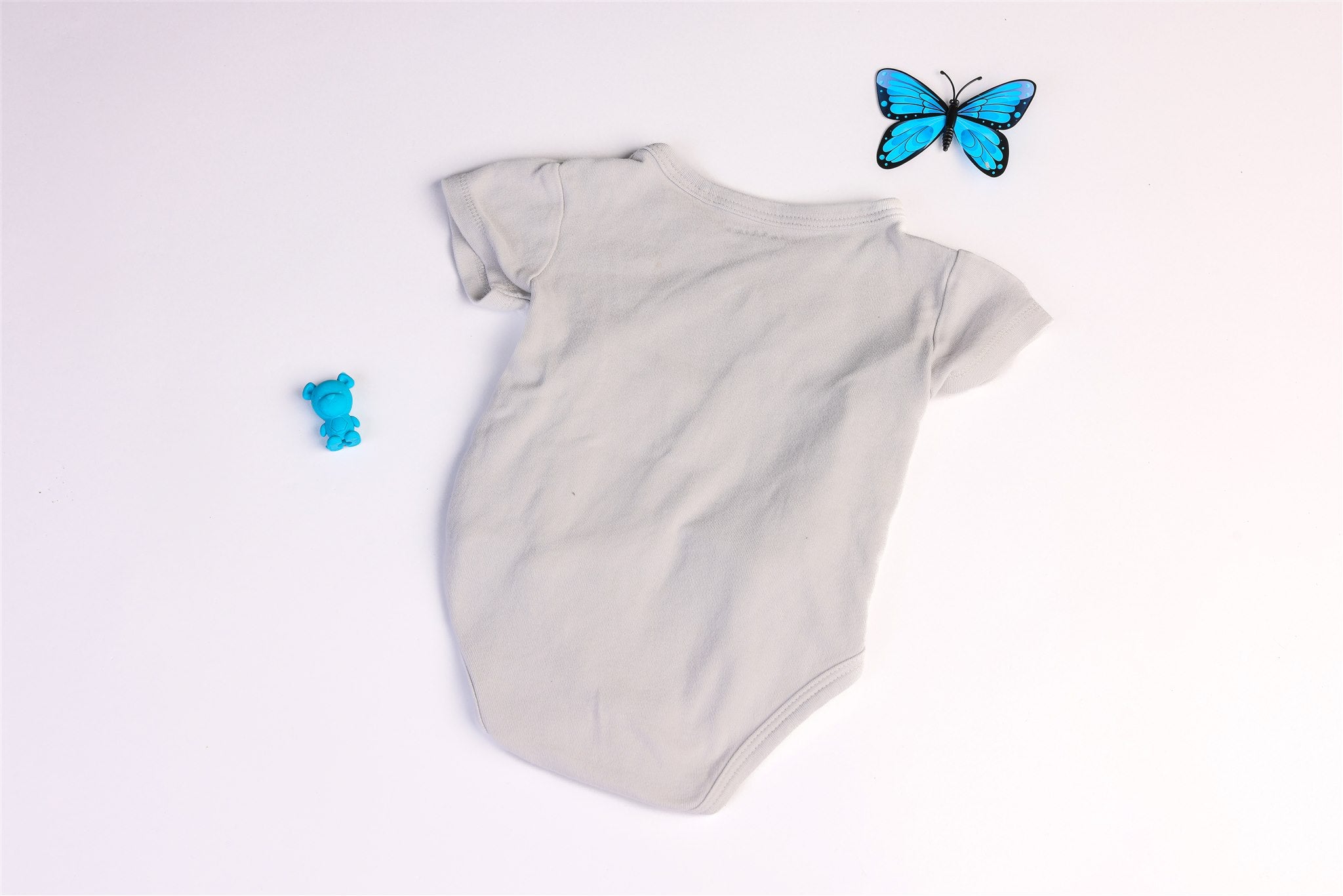 White bodysuit with blue bear
