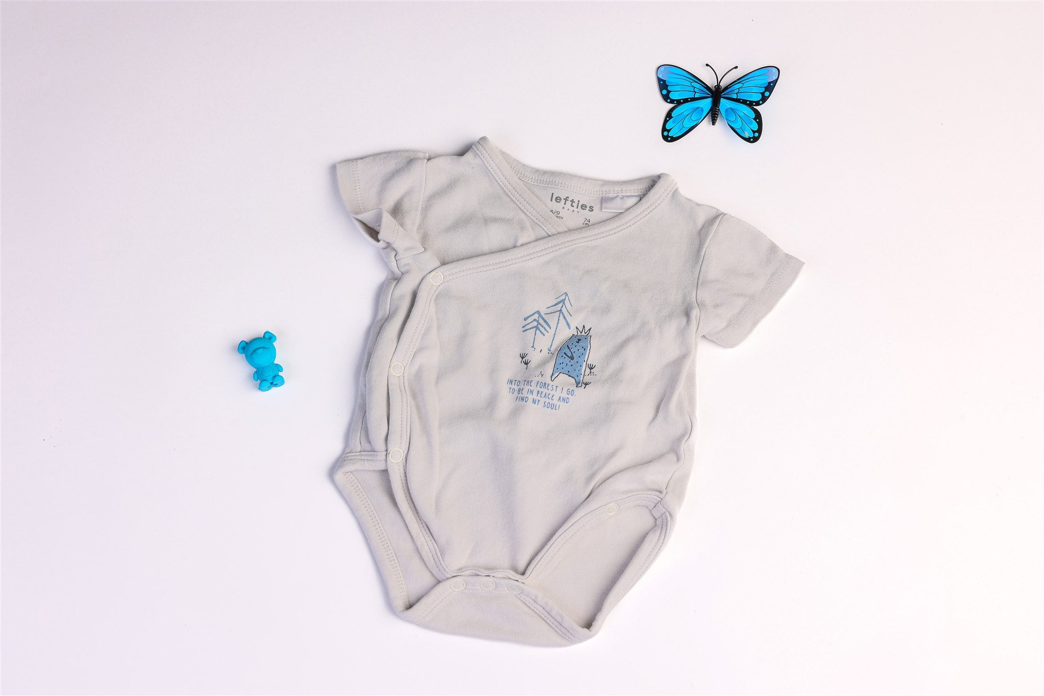 White bodysuit with blue bear