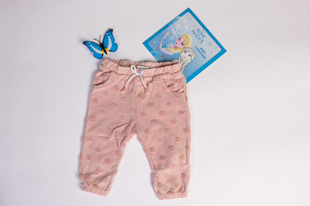 Pink trousers with raised polka dots