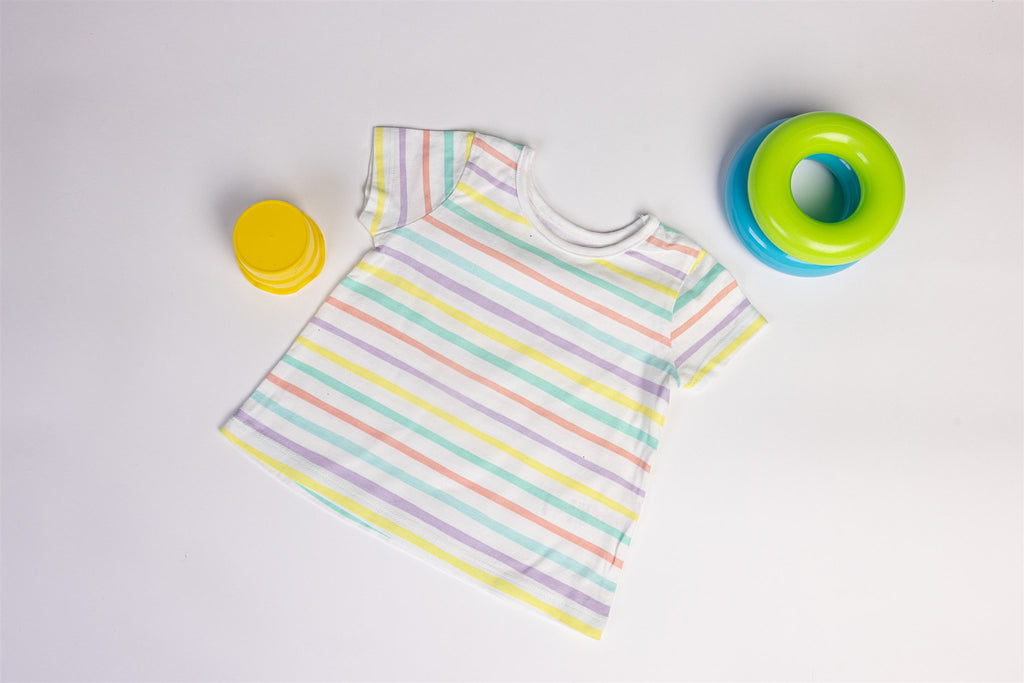 White top with yellow, salmon, and green stripes