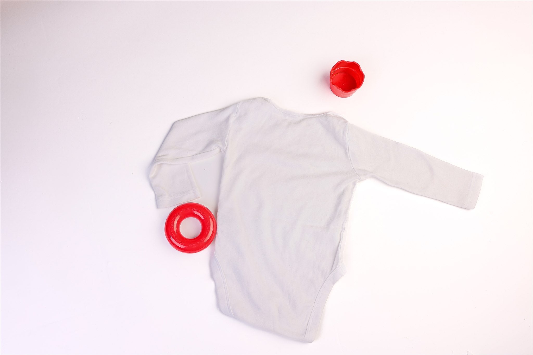 Long-sleeved bodysuit with a smile and a little heart