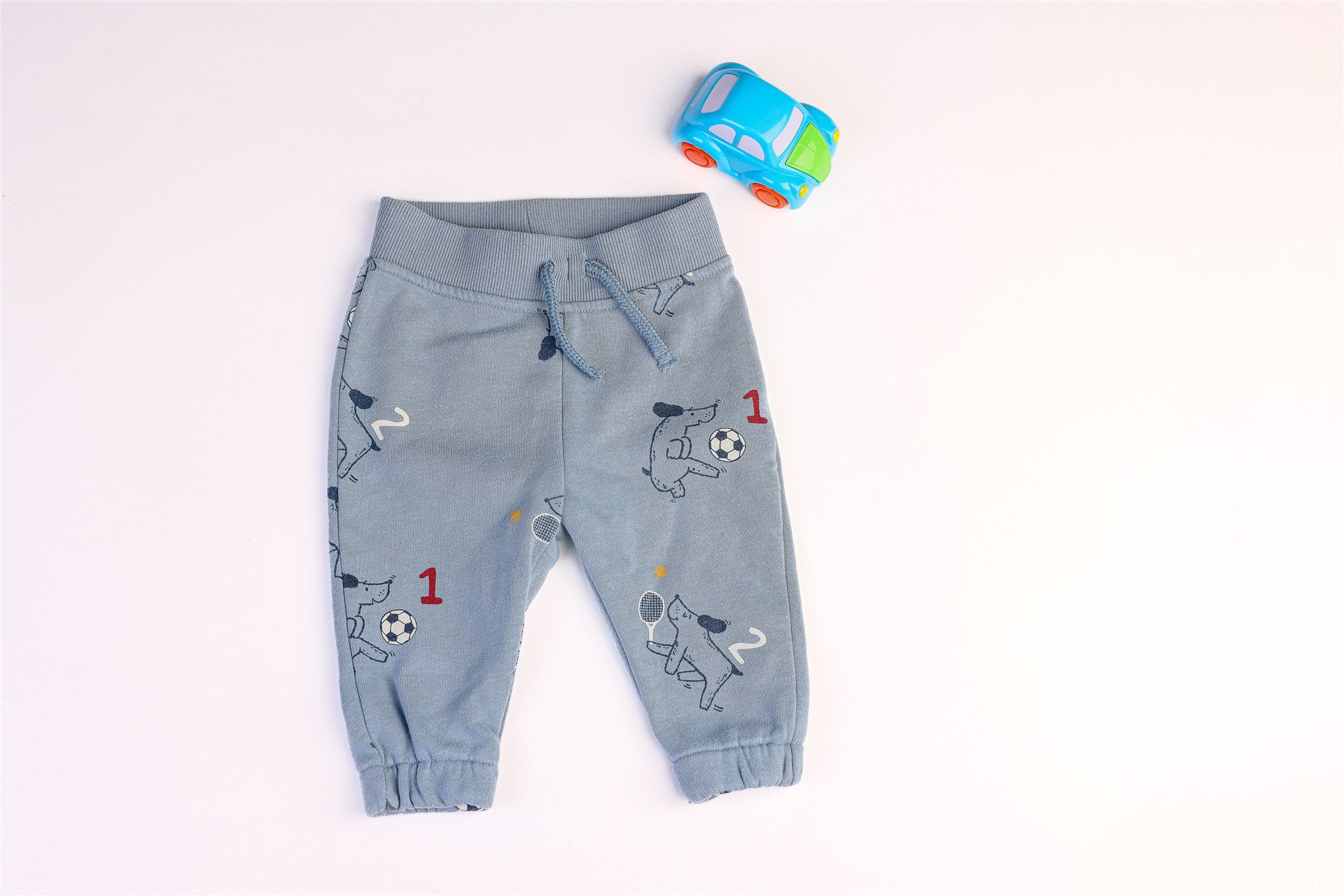 Blue trousers with dog and ball print