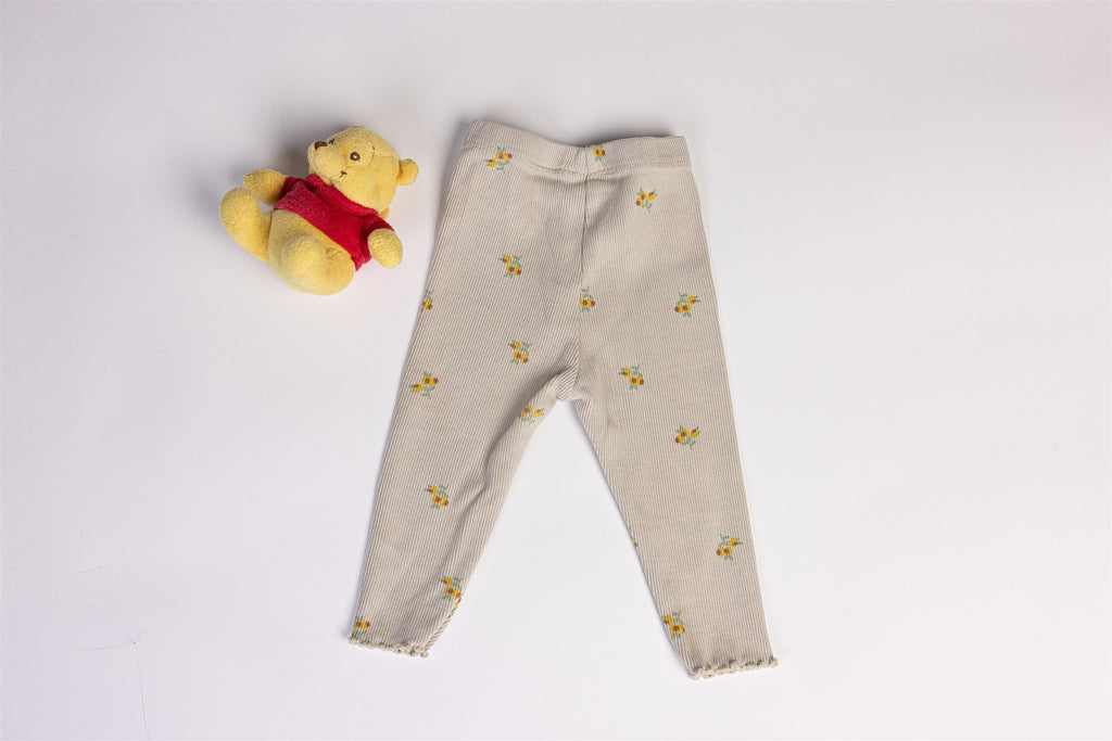Beige trousers with yellow flowers
