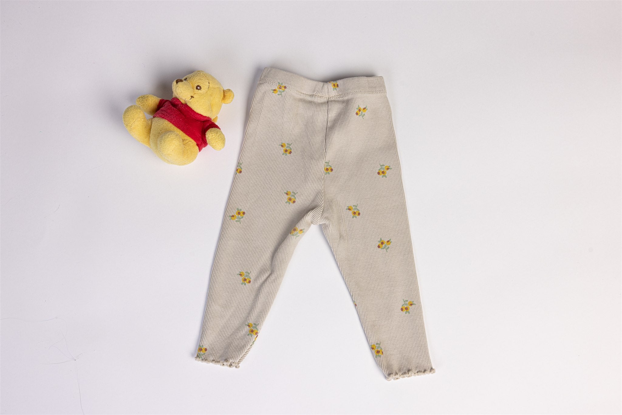 Beige trousers with yellow flowers