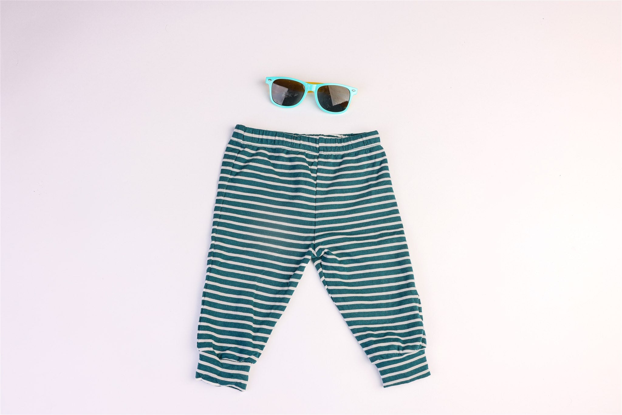 Green and white striped trousers