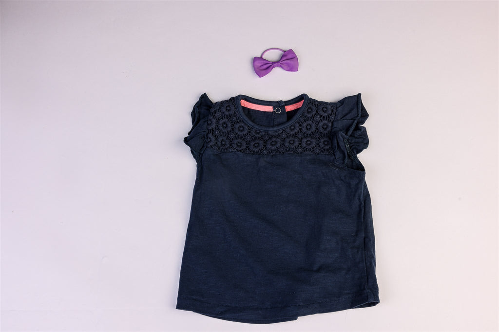 Blue top with floral decoration