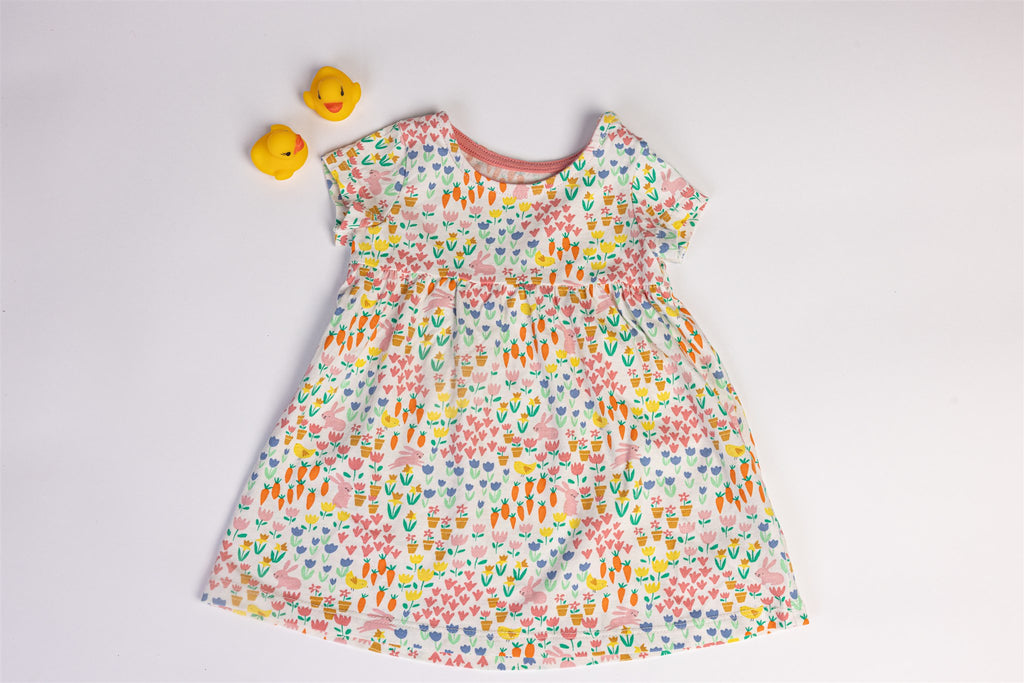 Dress with rabbit, carrot, and flower patterns
