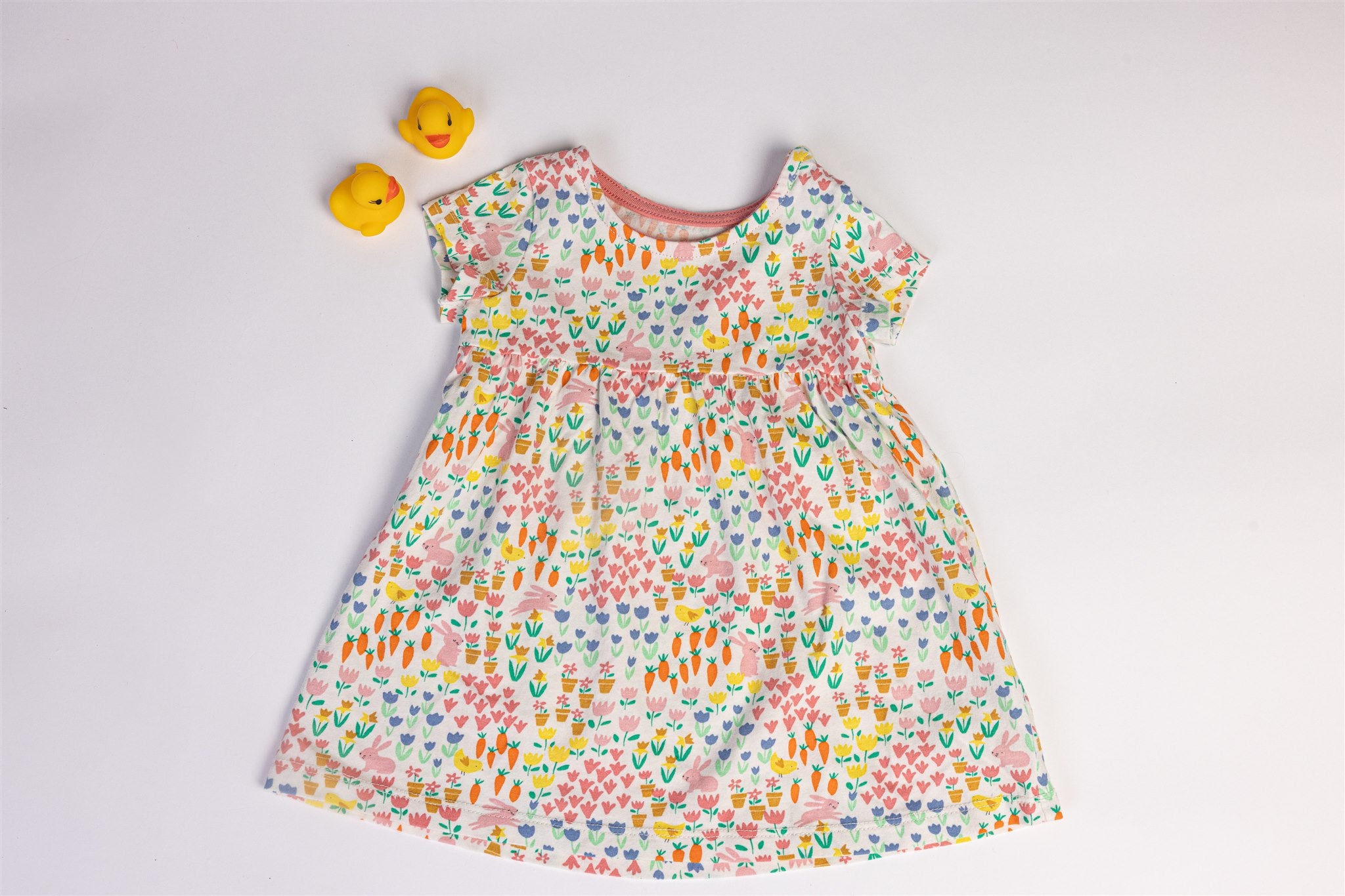 Dress with rabbit, carrot, and flower patterns
