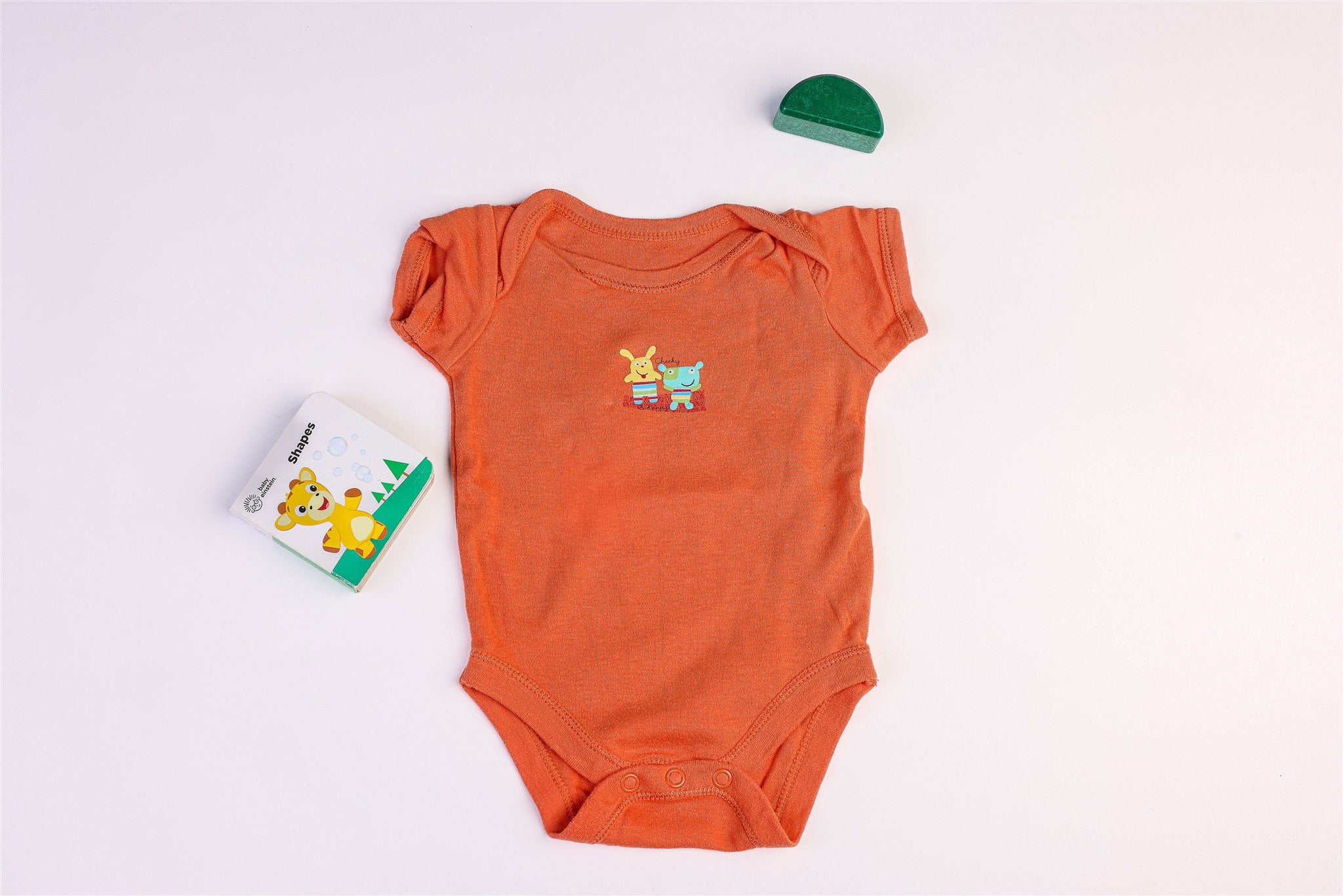 Orange bodysuit with two characters