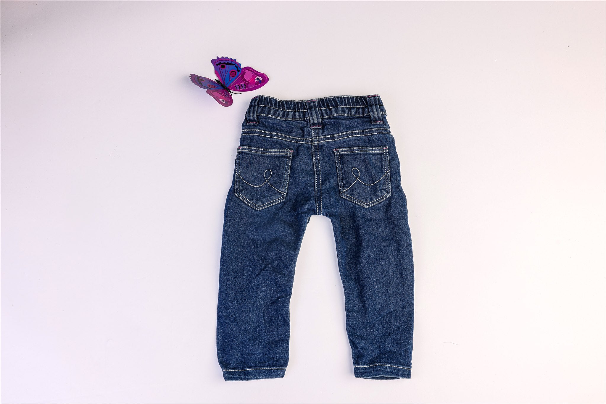 White and pink stitched jeans