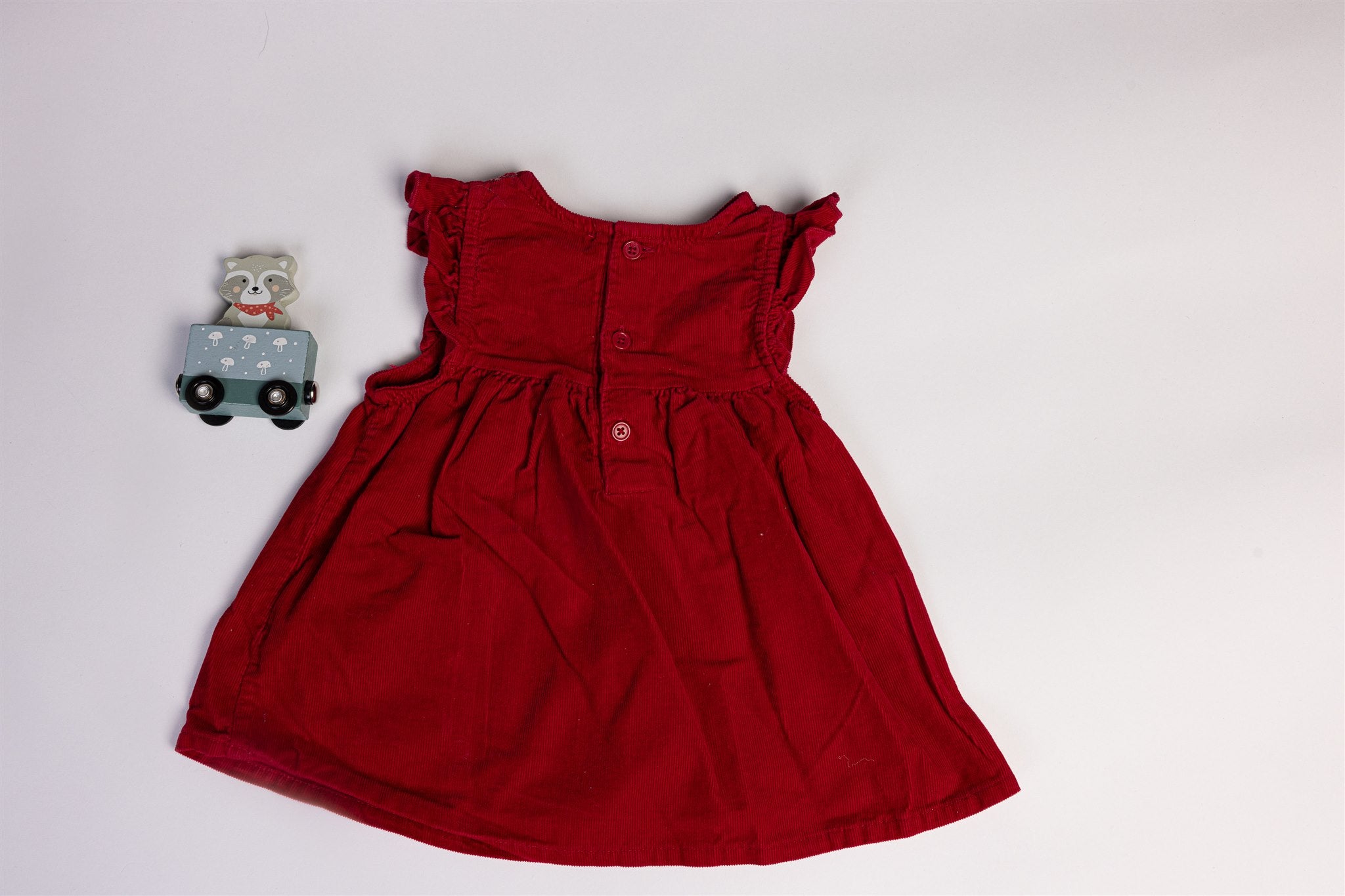 Red dress with hedgehogs and a small decorative bow