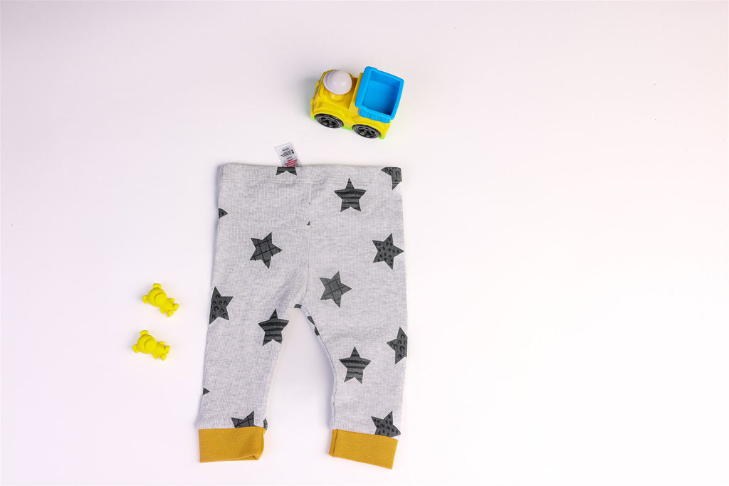 Grey trousers with black stars