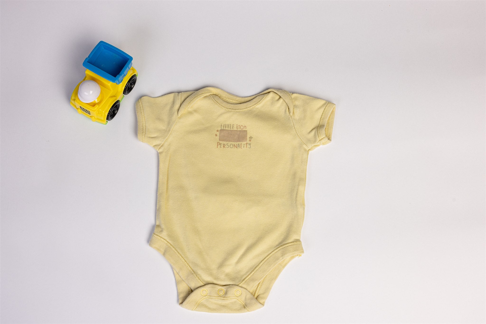 Yellow "Little Lion Personality" bodysuit
