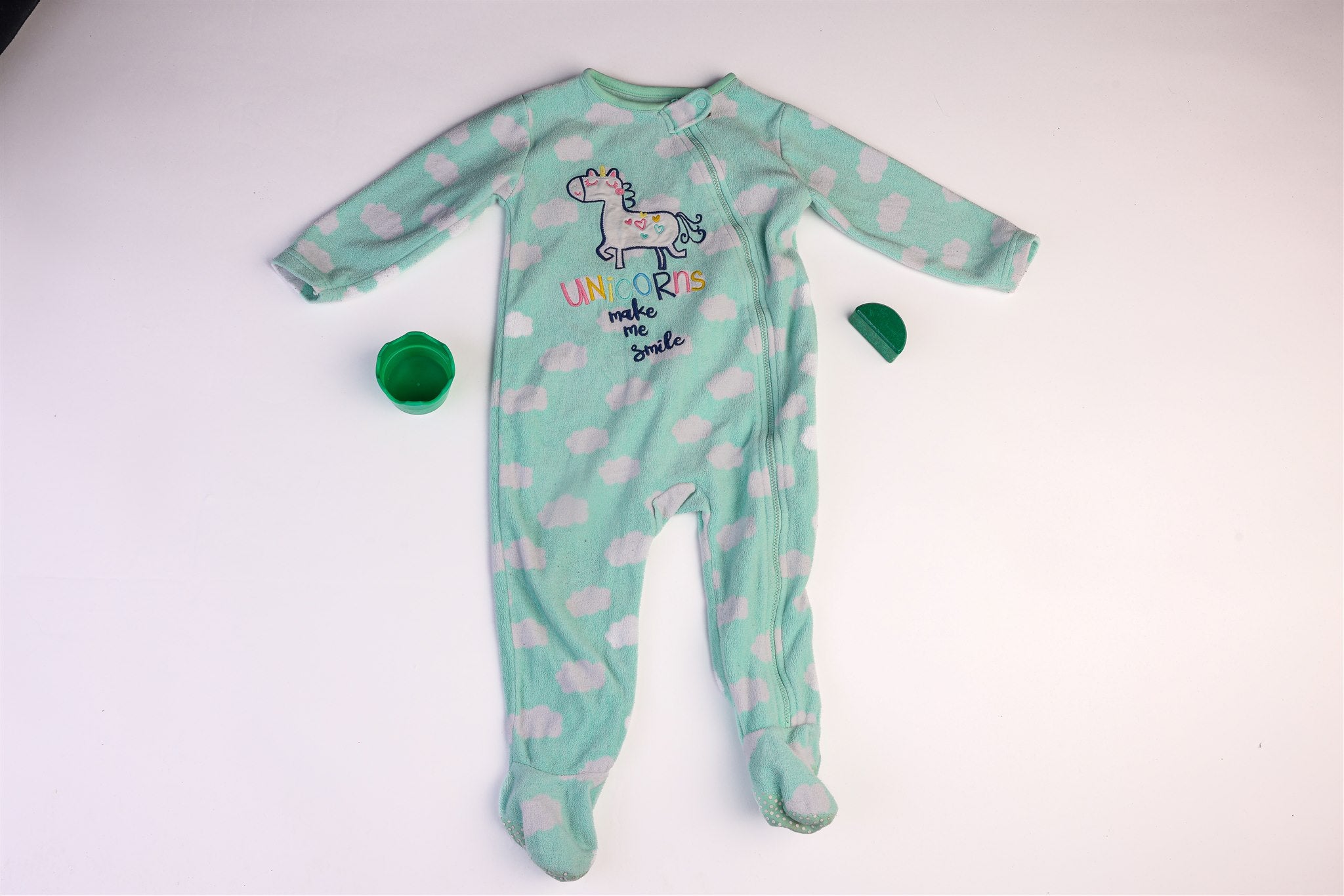 Green polka dot "Unicorns Make Me Smile" sleepsuit