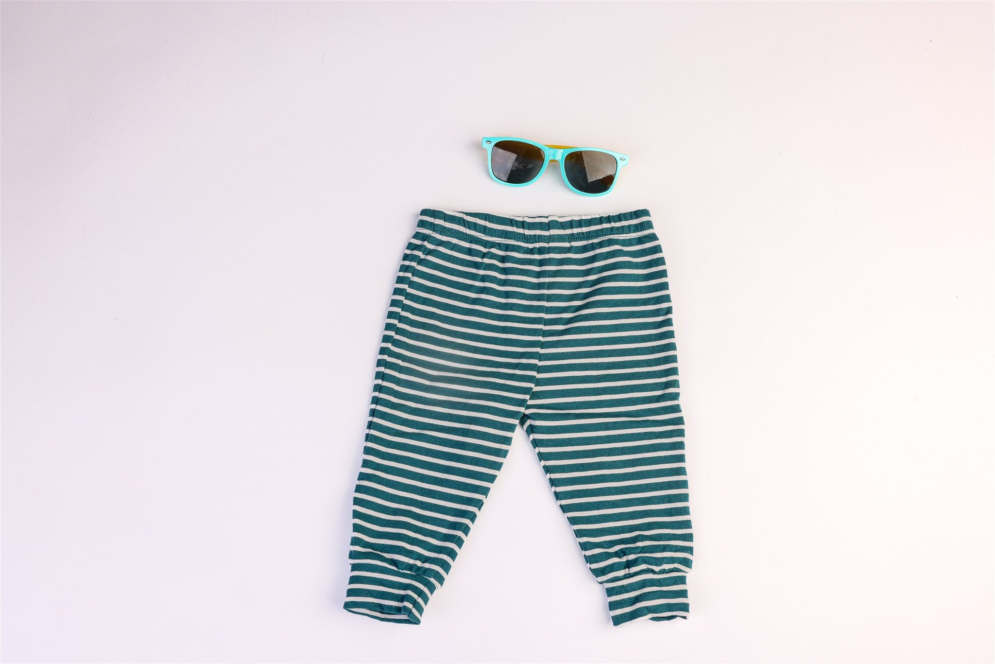 Green and white striped trousers