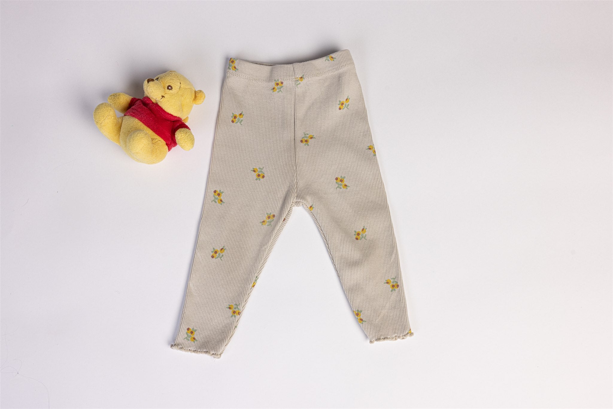 Beige trousers with yellow flowers