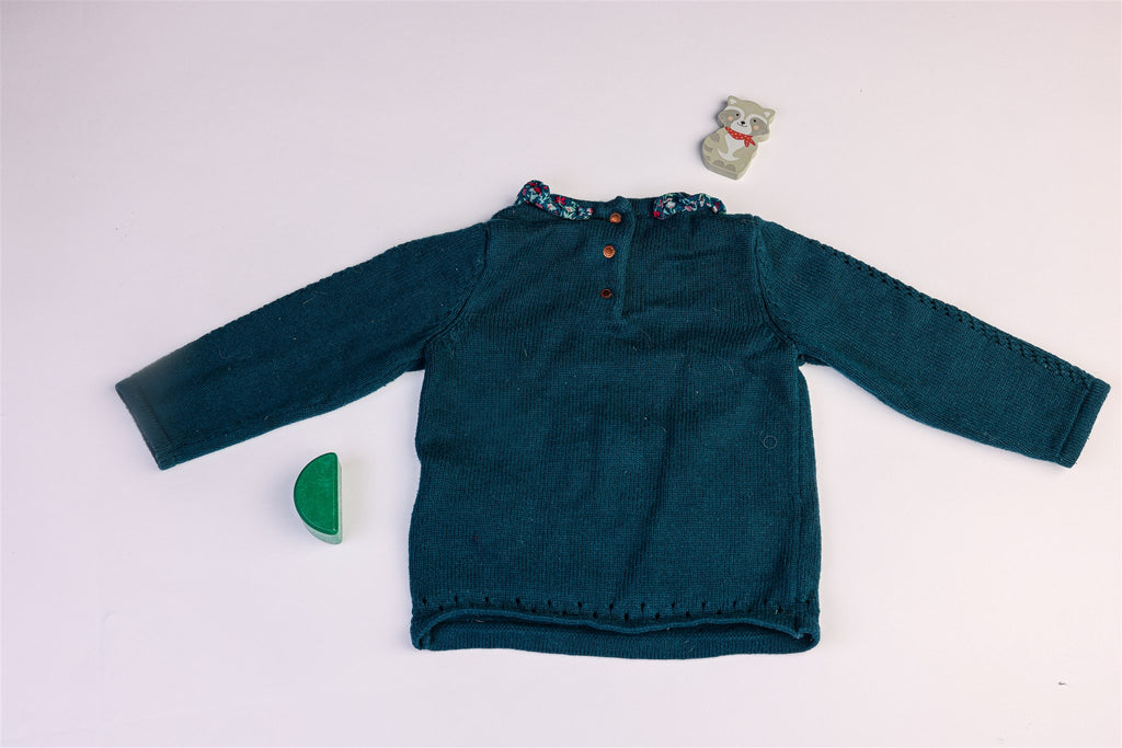 Green jumper with white rabbit and flowers