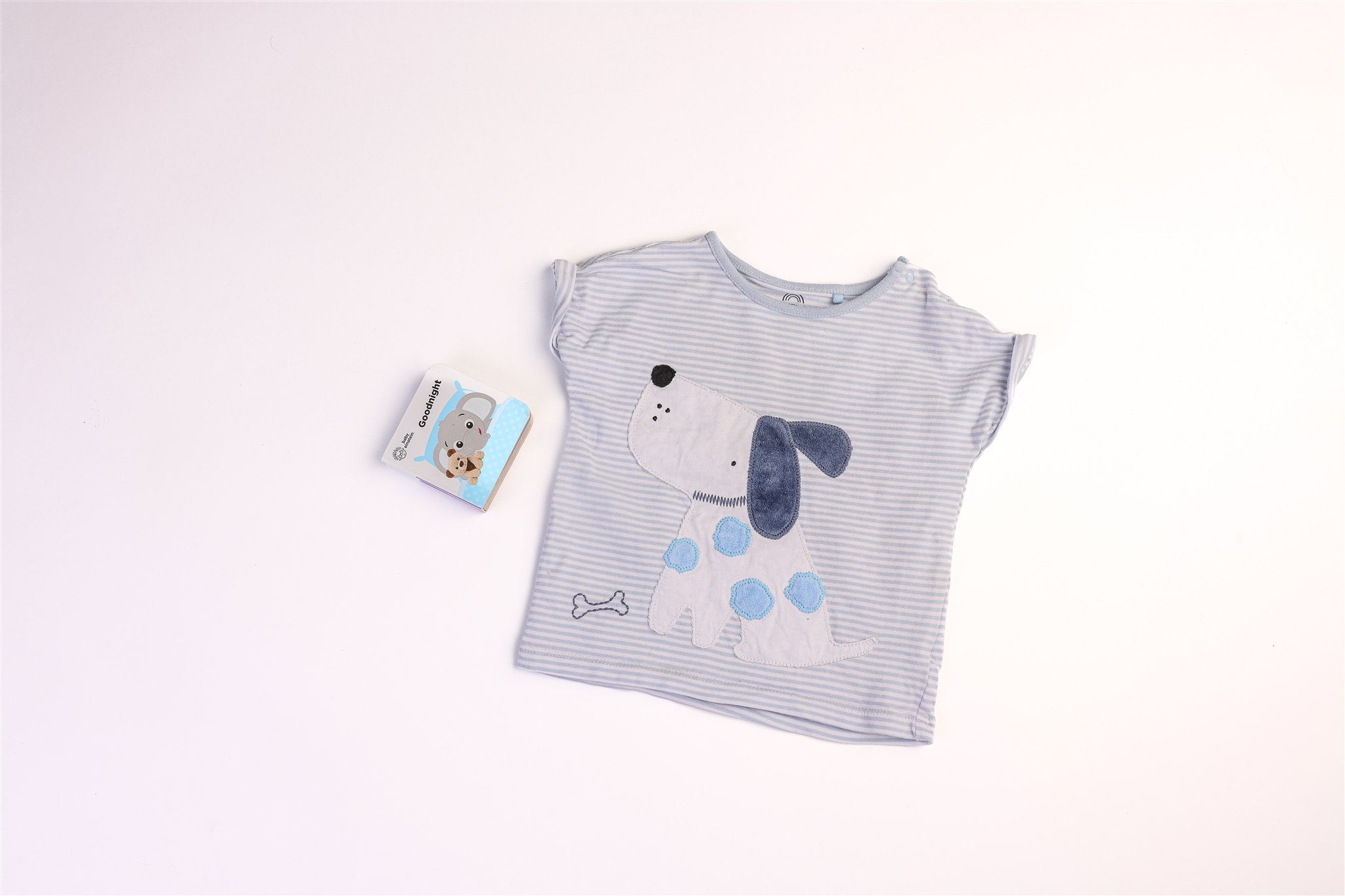 White and blue striped top with dog