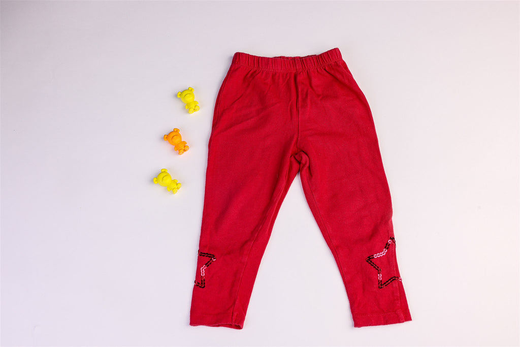 Red trousers with sequined stars